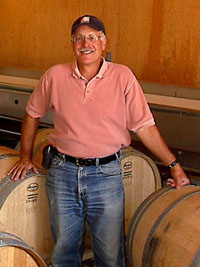 Randle G. Johnson among wine barrels